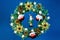 Christmas wreath, the lights of the Golden stars, Santa Claus, flowers and toys, a holiday of fun. Ð’Ñ‹Ð´ÐµÐ»Ð¸Ñ‚Ðµ Ñ‚ÐµÐºÑÑ‚,